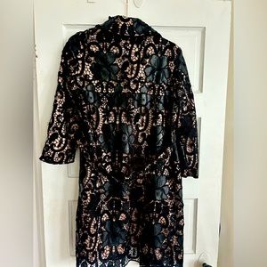 Vintage beautiful black leather look lace pattern detail.